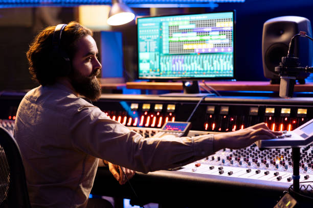 Sound engineer working in professional studio to mix and master tracks