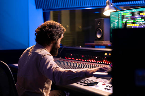 istock Producer mixing and mastering tracks in professional recording studio 2147586232