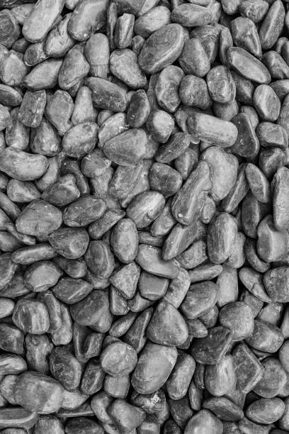 istock black stoner pebble texture background 2147586634