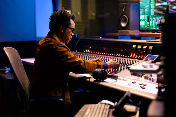 istock African american tracking engineer editing tunes in control room 2147587589