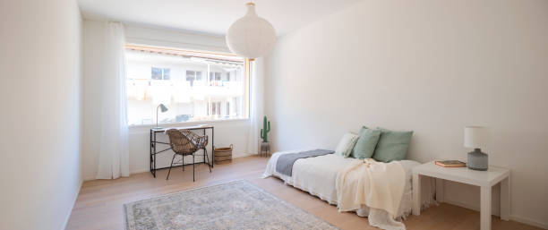istock Panoramic view of bedroom with large window. 2147588900