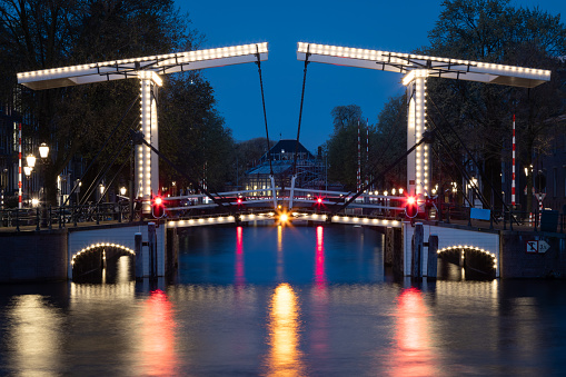 People skating on the historic central canal in Dokkum, Netherlands