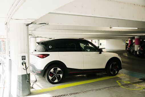 Toulouse, France - 29 March, 2024: A Smart #1 electric car charging in a parking lot