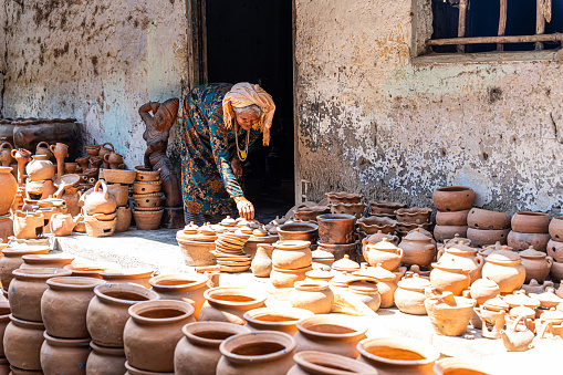 Bau Truc pottery village, Phan Rang city, Vietnam - 04 Mar 2024: old female of Cham ethnic girl in Bau Truc pottery village. People and travel concept.