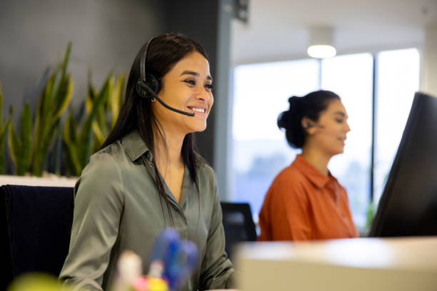 istock Happy businesswoman using a headset while making a video call at the office 2147591228