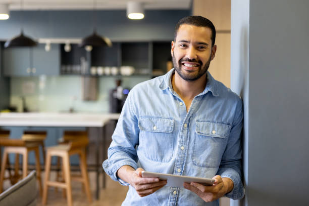 istock Happy businessman working on a digital tablet at the office 2147591362