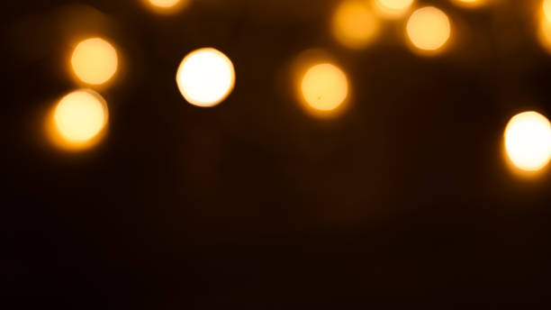 istock Rich brown-golden bokeh background, evoking warmth and elegance, 2147592140