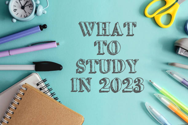 istock A blue background with a clock, scissors, pens, and pencils 2147592330