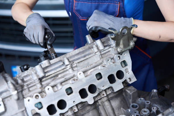 istock Auto mechanic at the workplace works with large auto part 2147592983