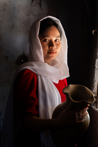 portrait of Cham ethnic girl in Bau Truc pottery village, Phan Rang city, Ninh Thuan province, Vietnam. People and travel concept.