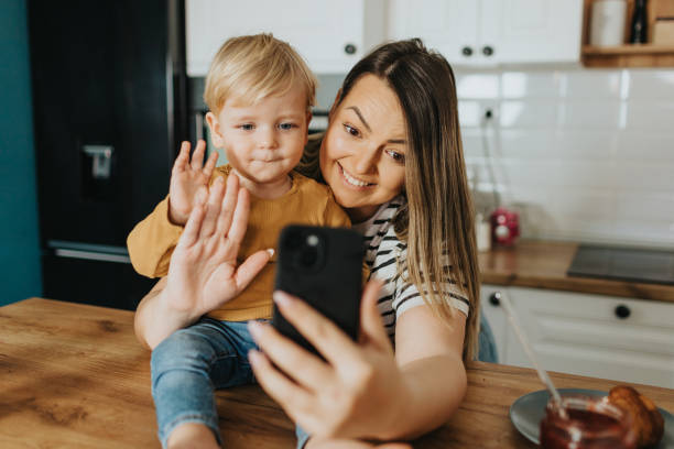 istock Mother and son having video call during breakfast 2147594482