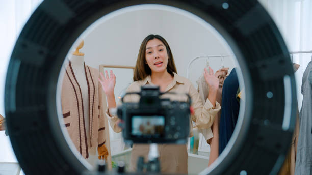 istock Asian woman live streaming for selling clothes 2147594596