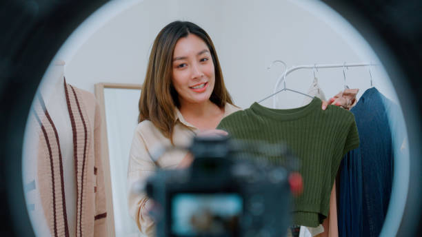 istock Asian woman live streaming for selling clothes 2147594599