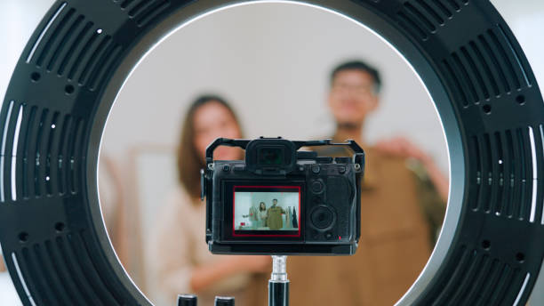 istock Asian couple live streaming for selling clothes 2147594689