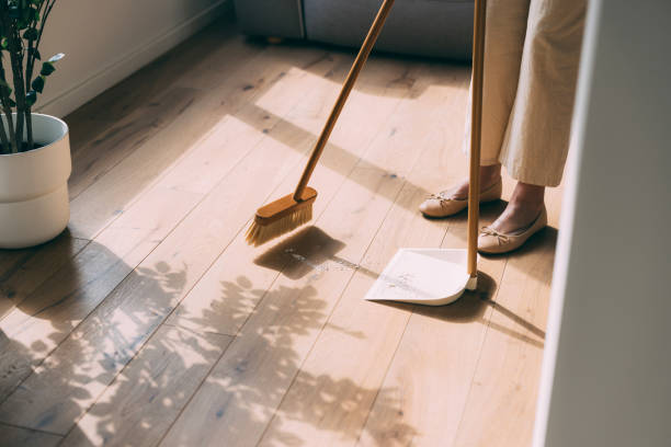 Sweeping Floor at Home with Dustpan and Broom