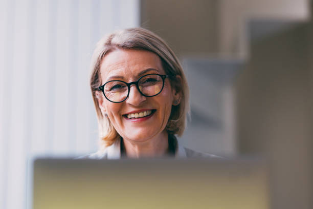 istock Professional Senior Businesswoman Smiling at Work 2147595523