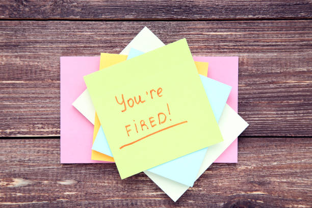 istock Text You Are Fired on paper on brown wooden table 2147598459