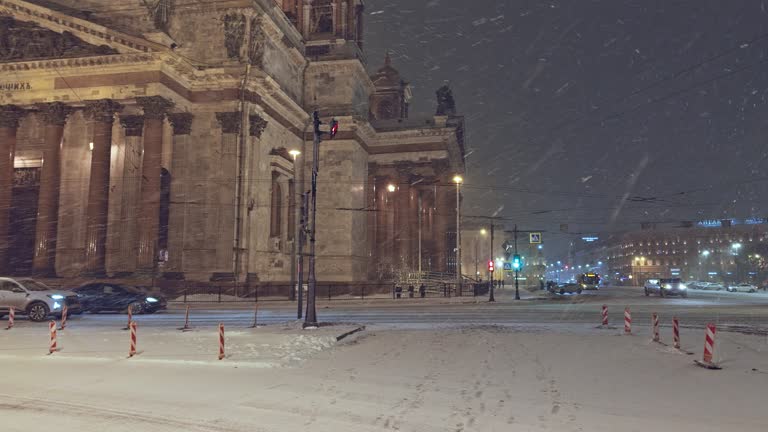 Night view of the monument St. Isaac's Cathedral in snowfall, Saint-Petersburg, Russia