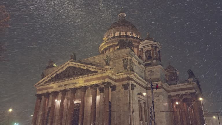 Night view of the monument St. Isaac's Cathedral in snowfall, Saint-Petersburg, Russia