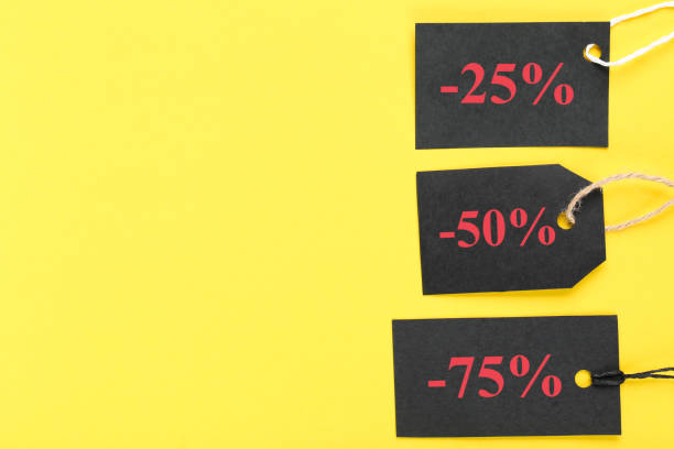 istock Sale tags on yellow background 2147600319