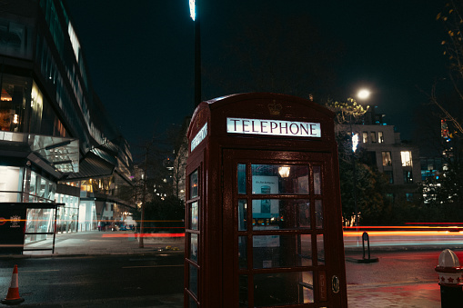 London's iconic telephone booth. Long exposure at night.