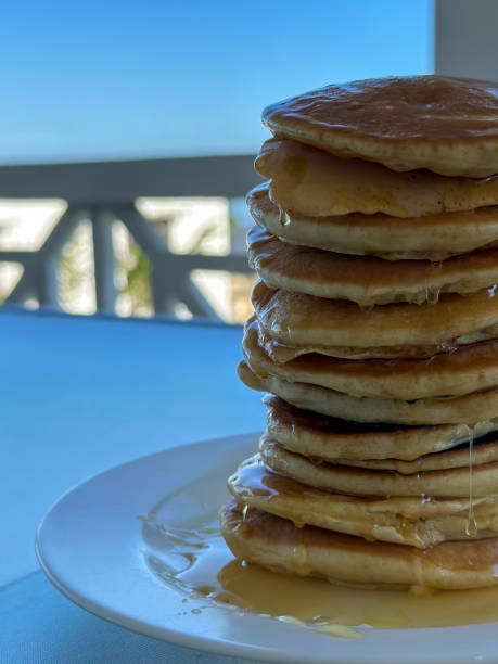 istock Close up of tall pancake stack with honey drips 2147603209