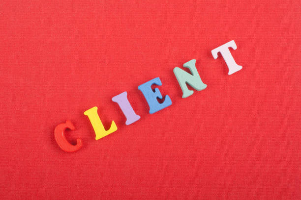istock CLIENT word on red background composed from colorful abc alphabet block wooden letters, copy space for ad text. Learning english concept. 2147605185