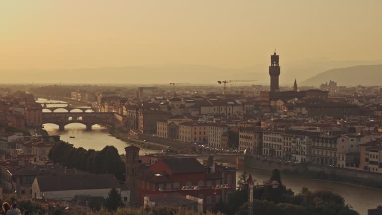 Cathedral of Saint Mary of the Flower at sunrise or sunset, Italy, Florence. Panoramic view of picturesque golden sunset city landscape. Tourism, holidays, weekend, vacation concept. Famous attraction