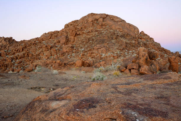 istock A rocky hill in a desert area with small plants 2147606534