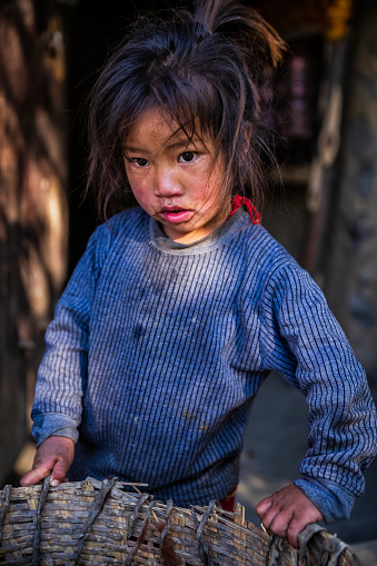Tibetan little girl from small village in Upper Mustang. Mustang region is the former Kingdom of Lo and now part of Nepal,  in the north-central part of that country, bordering the People's Republic of China on the Tibetan plateau between the Nepalese provinces of Dolpo and Manang.