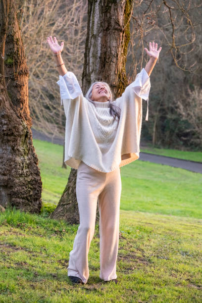 istock A happy woman enjoying the nature. 2147608045