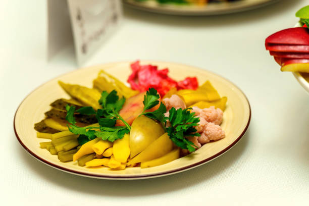 A plate with chopped pickled vegetables and herbs