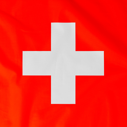 Flag of  Switzerland (Swiss Confederation) with natural material creases as a background