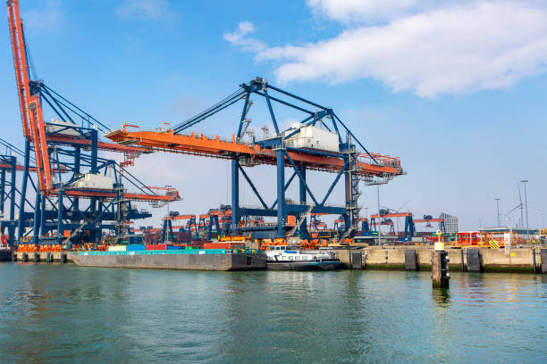 istock Large gantry cranes and container ship - port of Rotterdam - Maasvlakte 2147610607