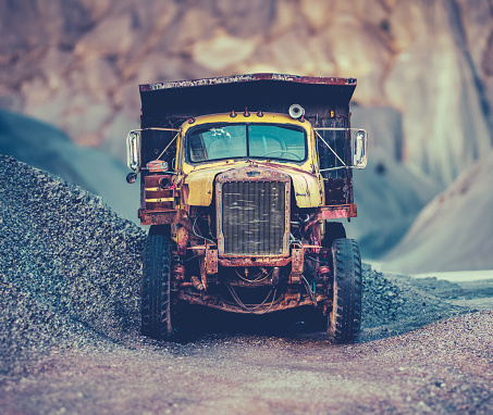 Heavy Industry Image Of A Rusty Old Dump Truck In A Quarry