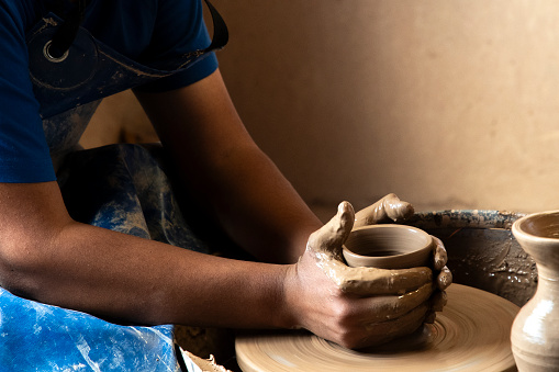 Native ceramist of Humahuaca, Jujuy, showing how to make ceramic