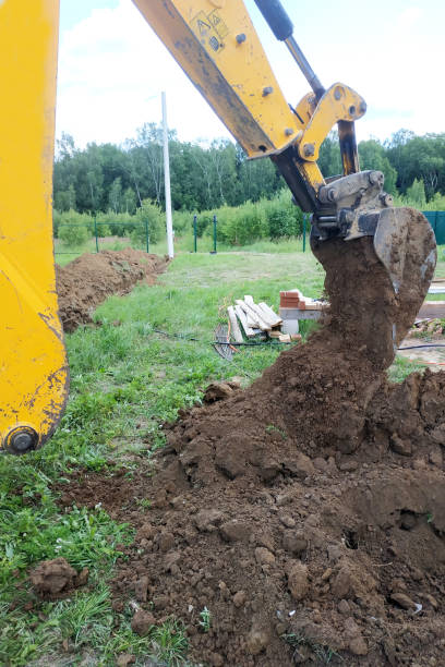 istock In a private plot, the excavator digs a trench. 2147615978