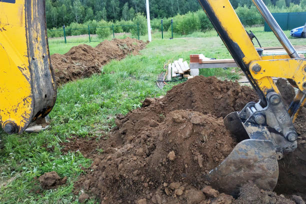 istock In a private plot, the excavator digs a trench. 2147615986
