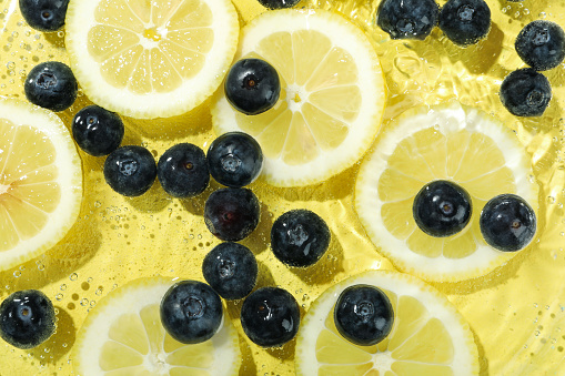 Concept of fresh summer fruits, blueberry and lemons