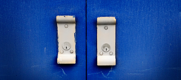 Blue industrial doors textured metal door with handles for opening and locks
