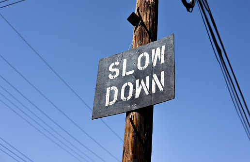 City Street Sign In California That Says Slow Down