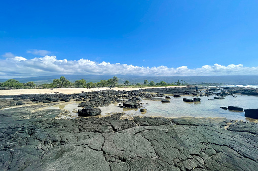 Taking in the views from the rocky shoreline on the big island of Hawaii