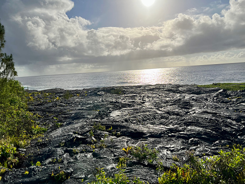 Taking in the beauty of the lava landscape as it meets the Pacific Ocean on the coastlines of Hawaii