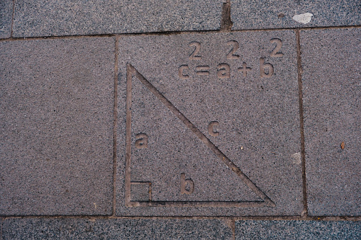 geometric process engraved on paving stone