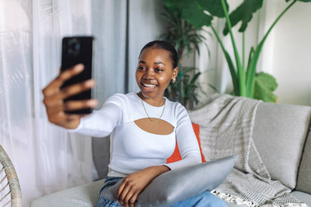 istock Young woman enjoying a video call at home 2147634482