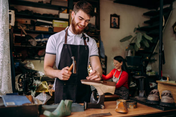 istock Team of young cobblers 2147636478