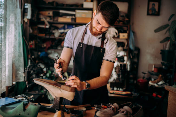 istock Portrait of a Young smiling cobbler 2147637729