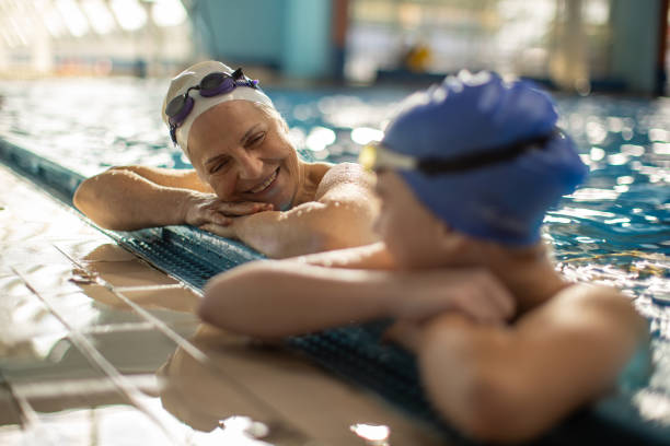 istock Girl and grandma swimmers taking a break 2147640745