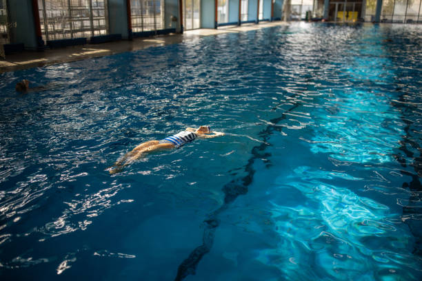 istock Old woman swimming 2147640772