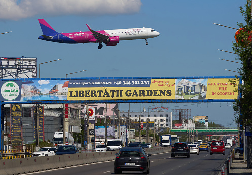 Otopeni, Romania. 8th Apr, 2024: Flight Stockholm to Bucharest, W43202, of the low cost airline Wizz Air lands at Bucharest Henri Coanda International Airport (AIHCB), over the National Road no. 1 in Otopeni, 16.5 km north of Bucharest.